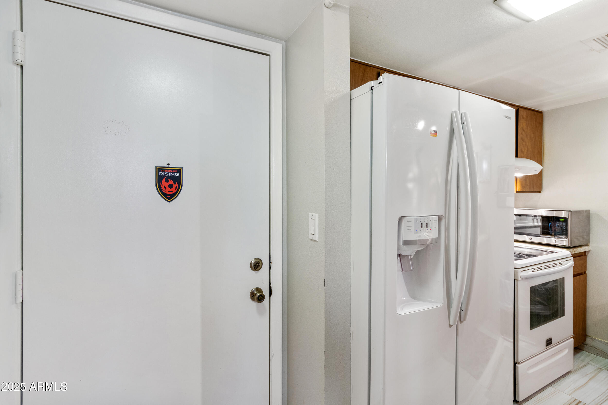 3033 East Devonshire Avenue, Unit 3003 Phoenix, AZ 85016 - Photo 12 of 45 a bathroom with a shower and a refrigerator