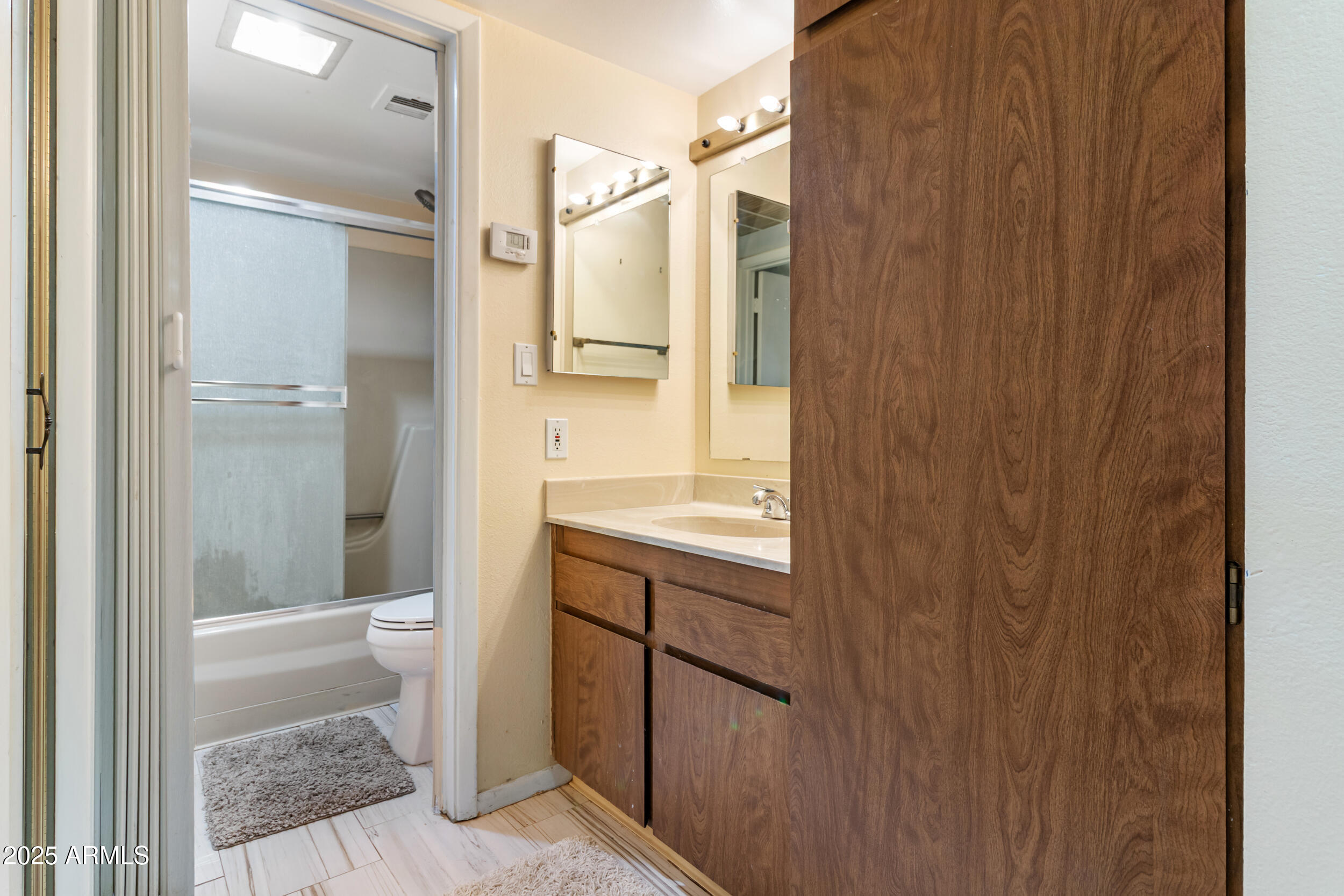 3033 East Devonshire Avenue, Unit 3003 Phoenix, AZ 85016 - Photo 18 of 45 a bathroom with a shower and a sink