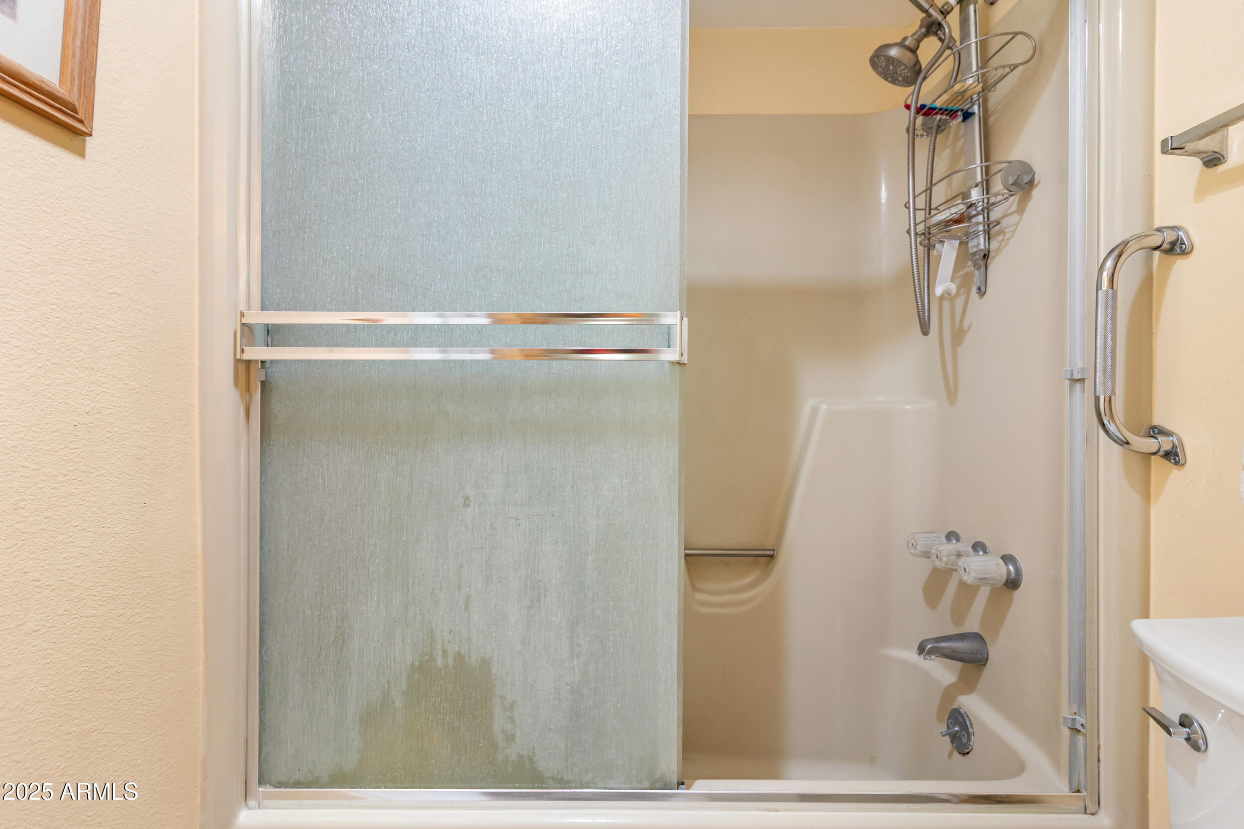 3033 East Devonshire Avenue, Unit 3003 Phoenix, AZ 85016 - Photo 19 of 45 a bathroom with a glass shower door