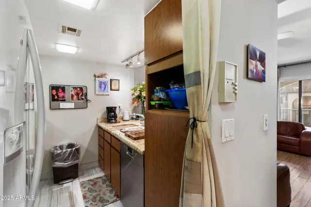 a kitchen with stainless steel appliances a stove a refrigerator and a refrigerator