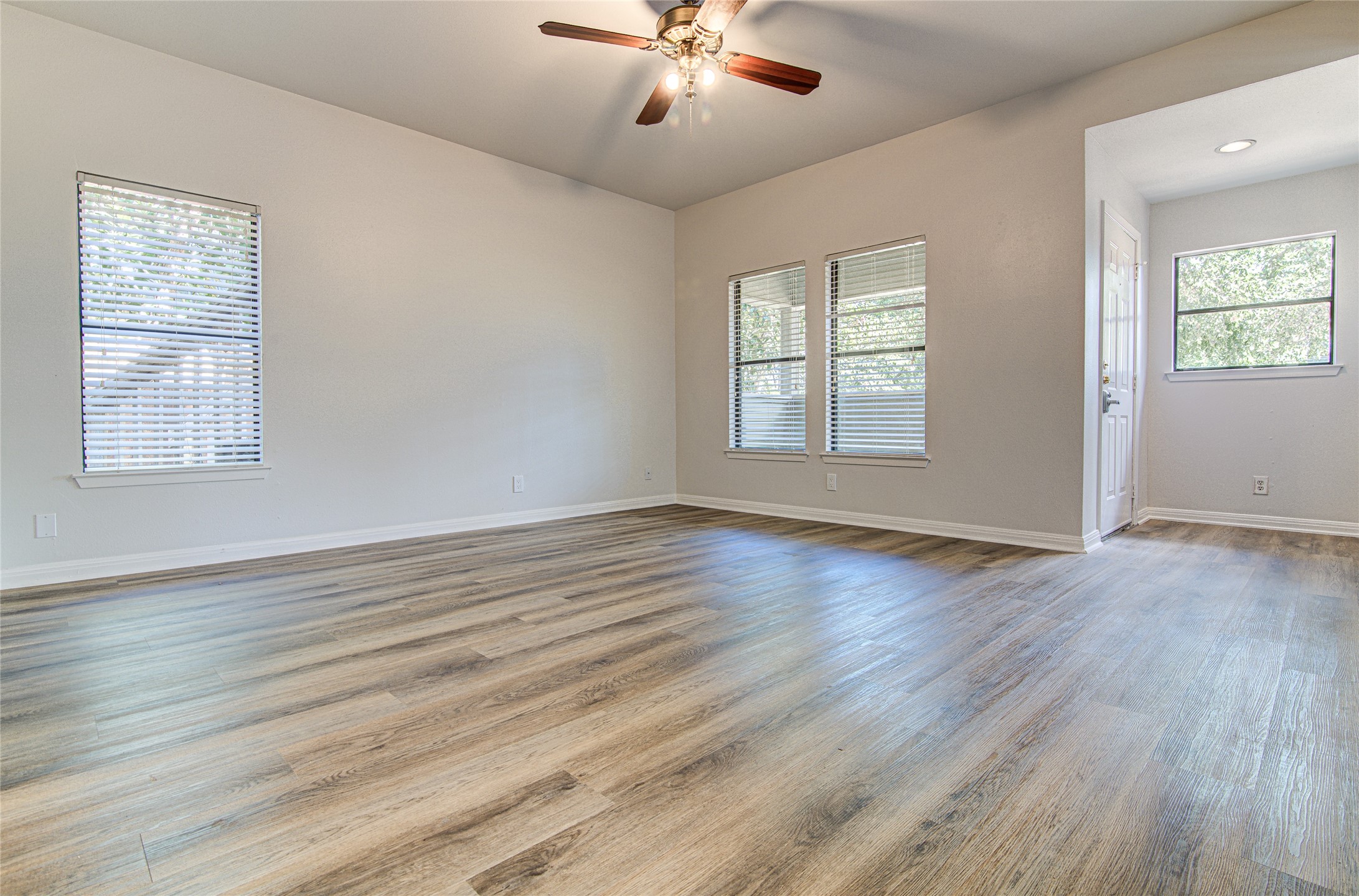 311 West Mary Street Austin, TX 78704 - Photo 24 of 35 A pristine open living space with rich wood-look flooring and ample natural light.