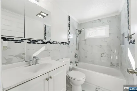 a view of room with wooden floor