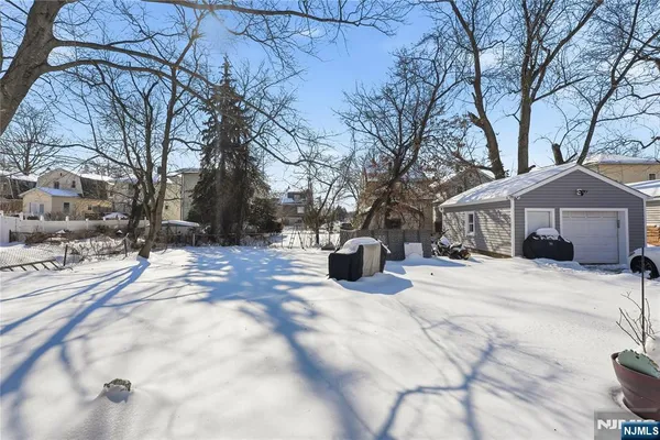 a view of a house with snow on the road