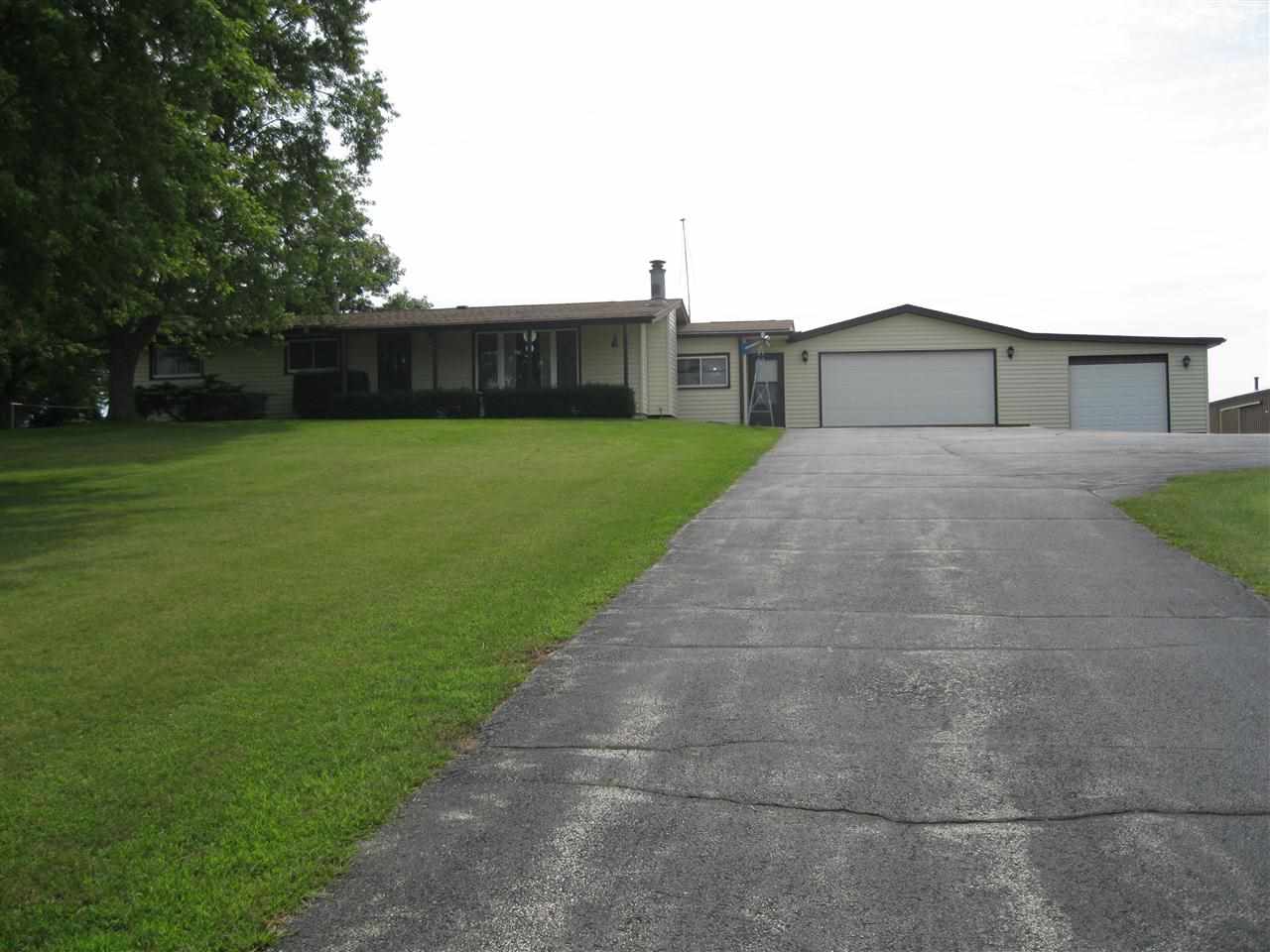 7114 Stephens Road Rockton, IL 61072 - Photo 1 of 20 a view of a house with a back yard