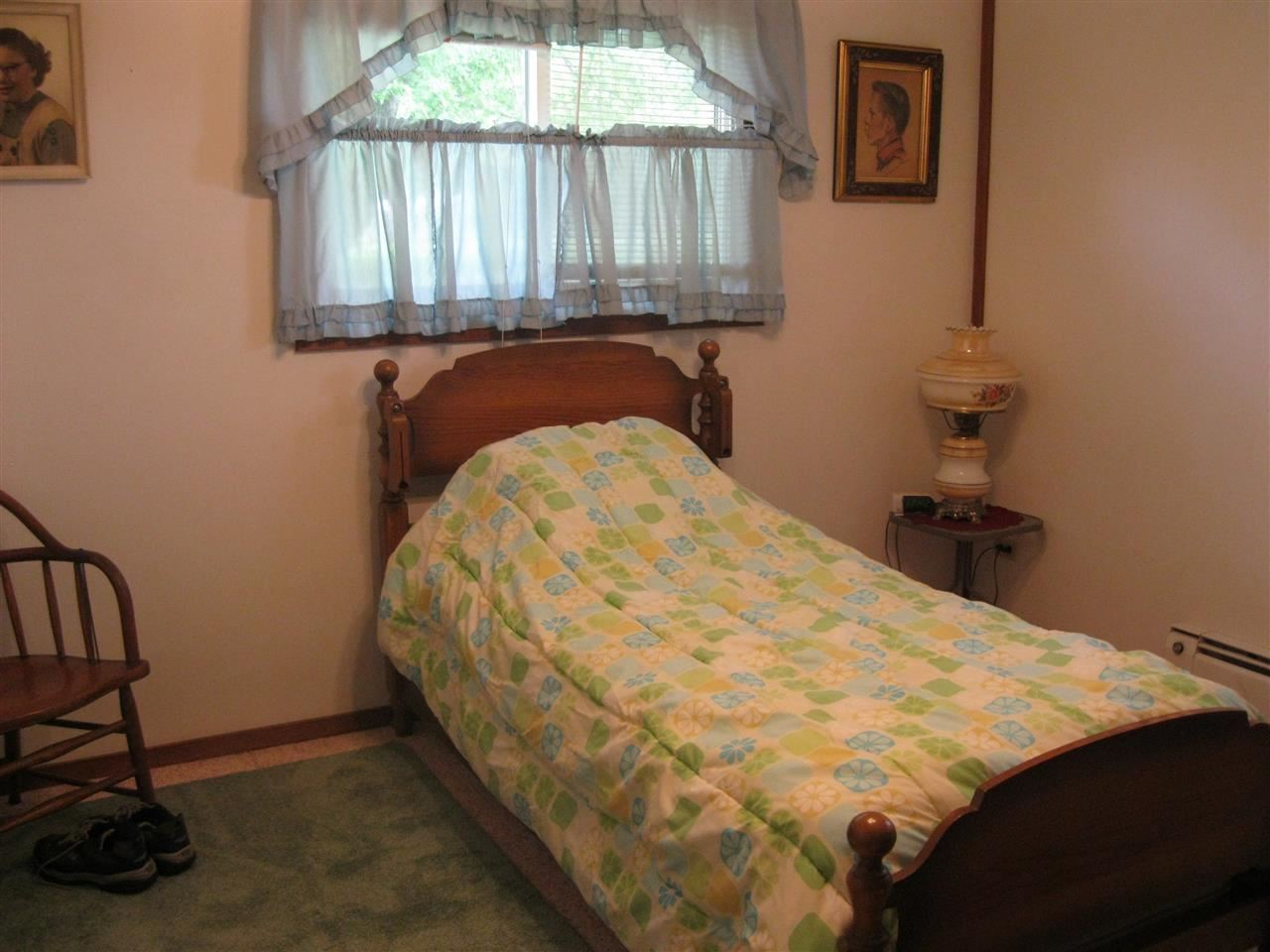 7114 Stephens Road Rockton, IL 61072 - Photo 11 of 20 a bed sitting in a bedroom next to a window
