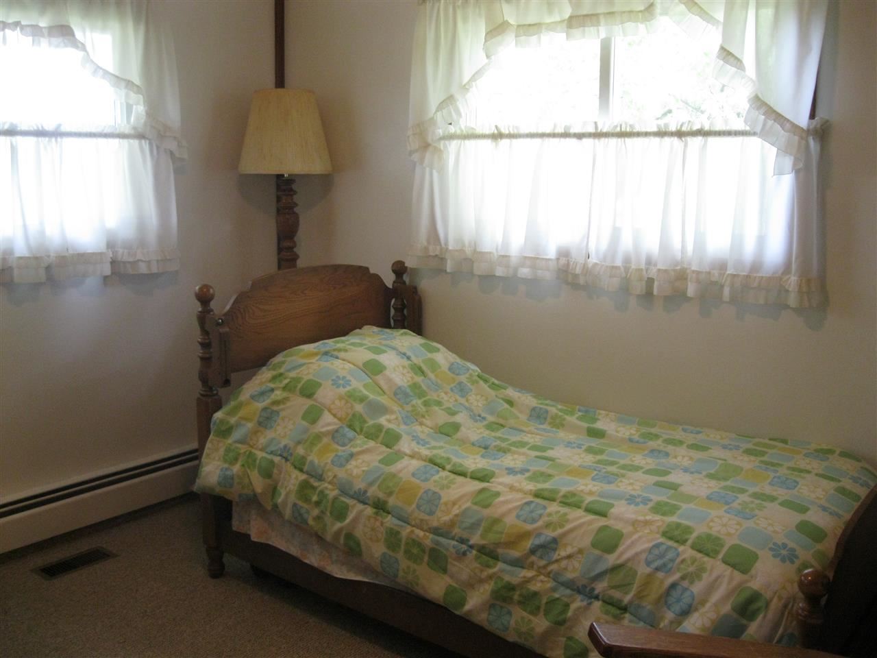 7114 Stephens Road Rockton, IL 61072 - Photo 12 of 20 a bedroom with a bed and a window