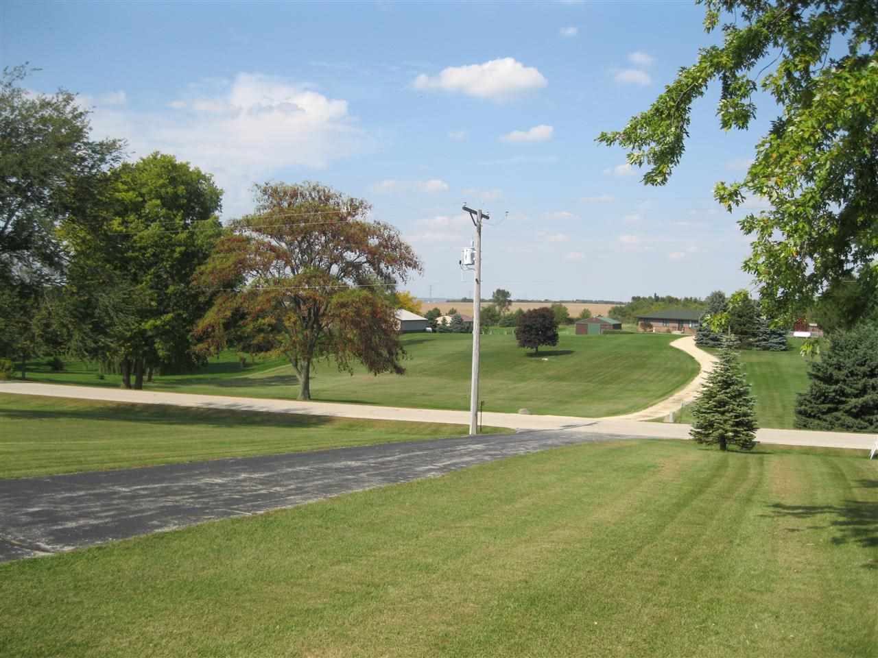 7114 Stephens Road Rockton, IL 61072 - Photo 20 of 20 a view of a lake with a big yard