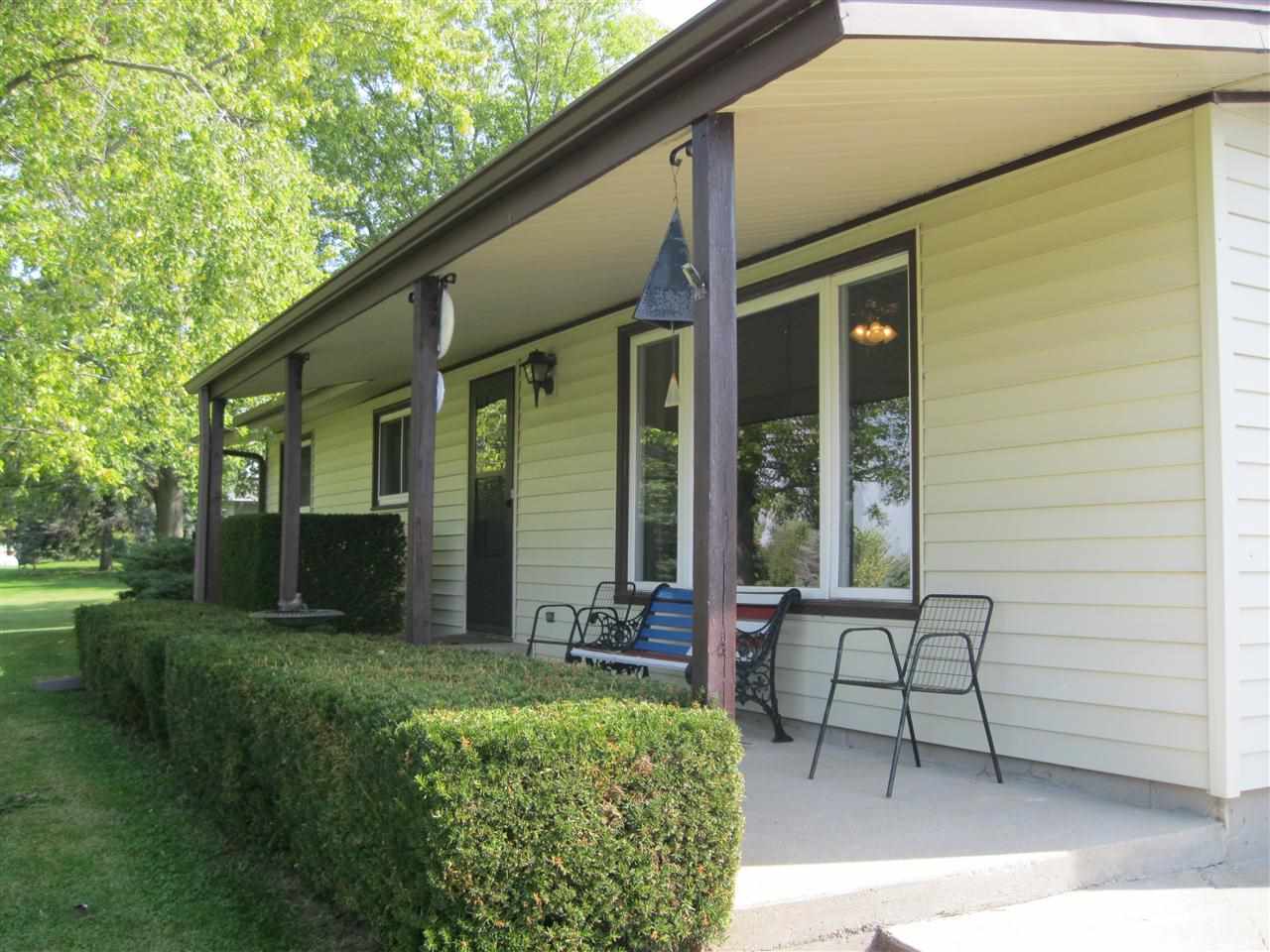 7114 Stephens Road Rockton, IL 61072 - Photo 2 of 20 a view of a chair and table in backyard of the house