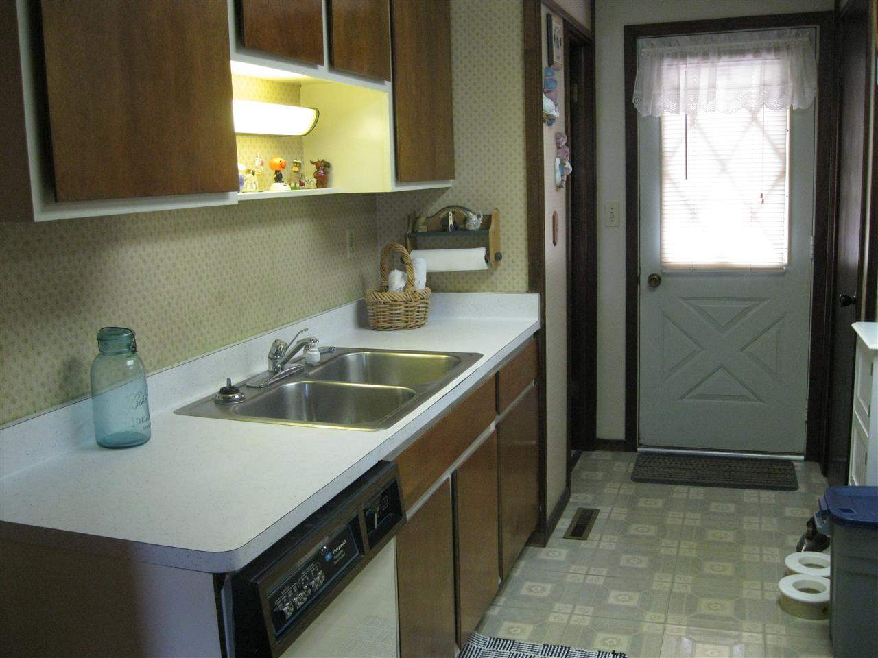 7114 Stephens Road Rockton, IL 61072 - Photo 7 of 20 a bathroom with a sink and a mirror