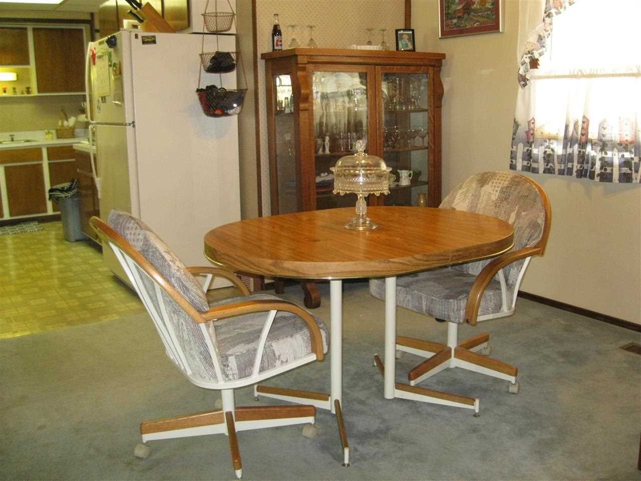 7114 Stephens Road Rockton, IL 61072 - Photo 8 of 20 a dining room with furniture and window