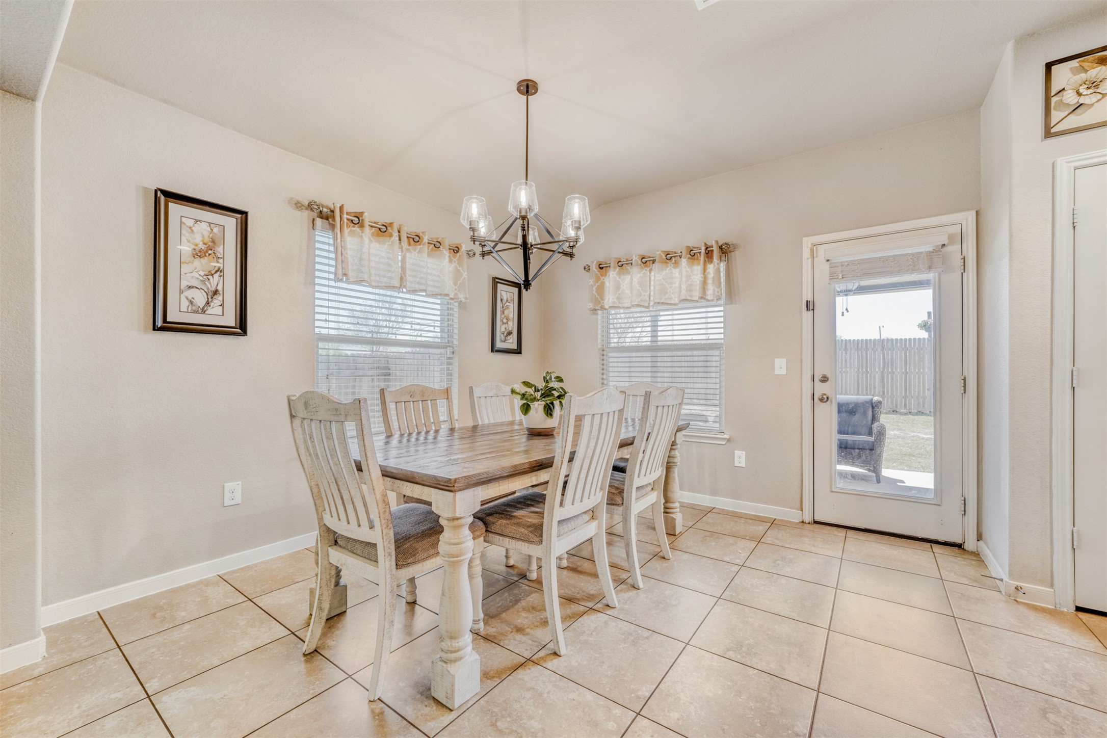 952 Palo Duro Loop Round Rock, TX 78664 - Photo 12 of 37 a view of a dining room with furniture and chandelier