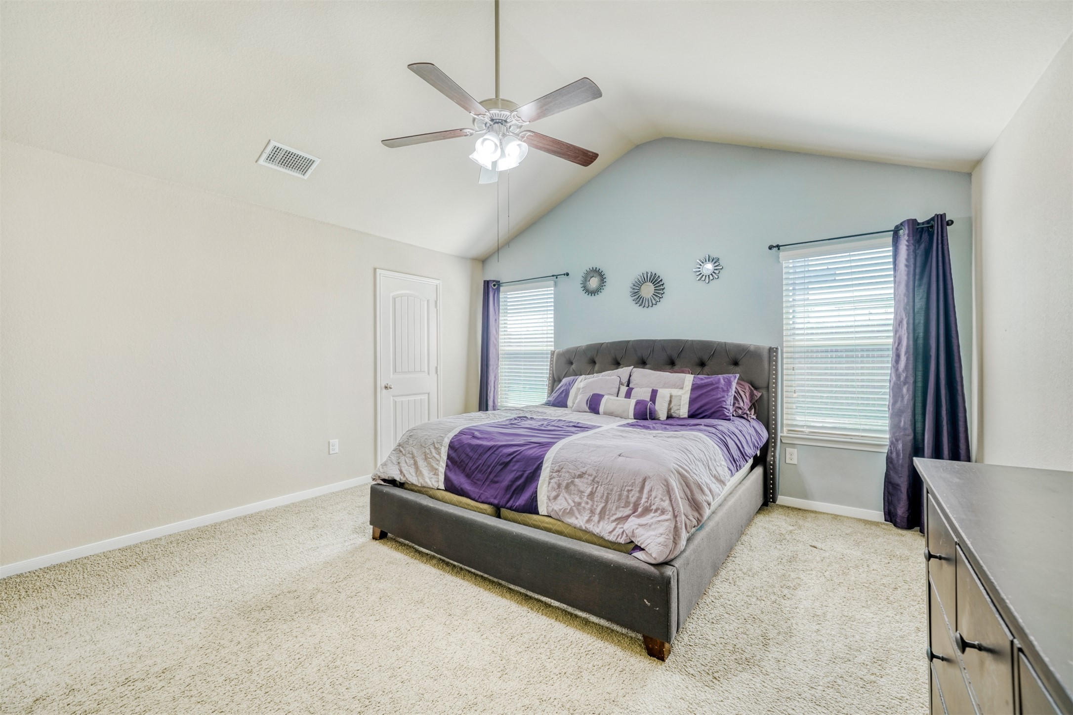 952 Palo Duro Loop Round Rock, TX 78664 - Photo 21 of 37 a spacious bedroom with a bed and a chandelier