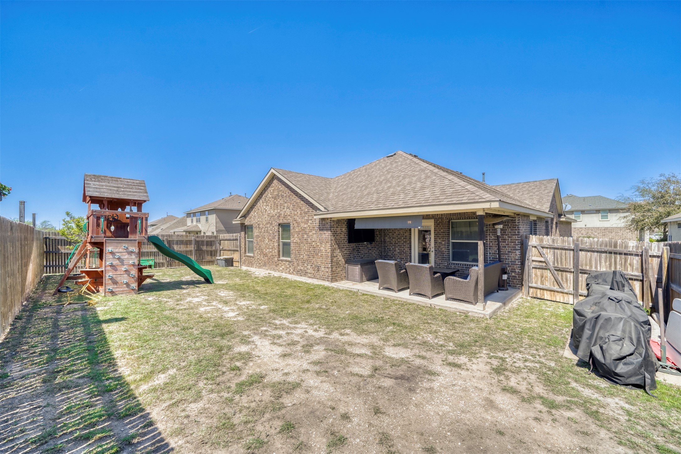952 Palo Duro Loop Round Rock, TX 78664 - Photo 31 of 37 a view of a house with wooden deck and furniture