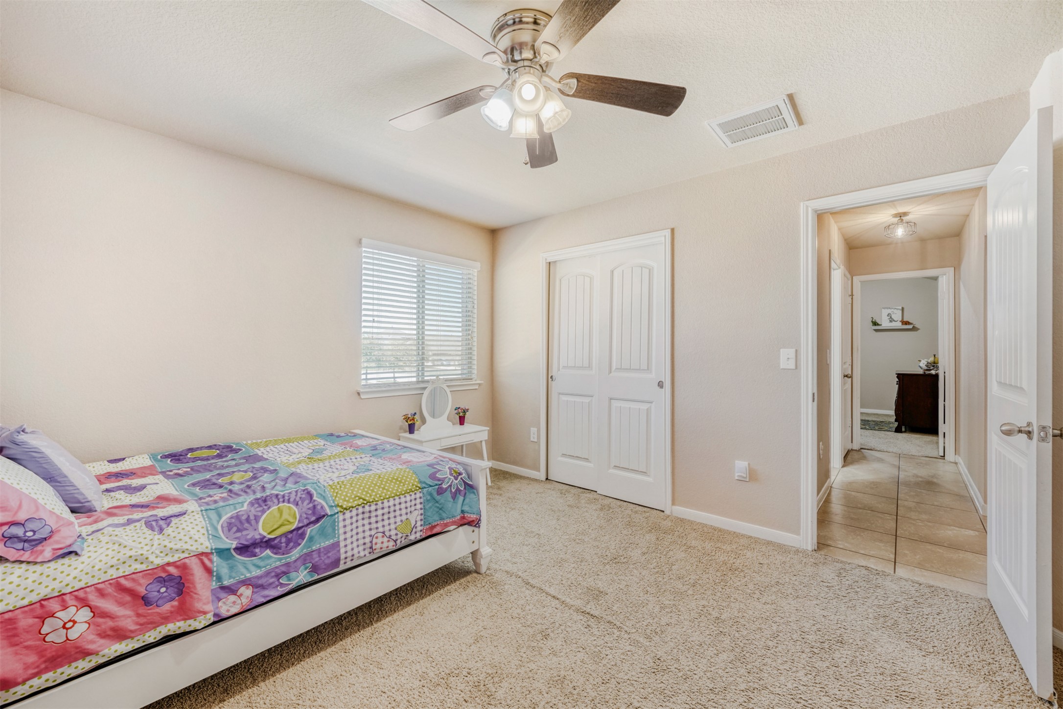 952 Palo Duro Loop Round Rock, TX 78664 - Photo 33 of 37 a bedroom with a bed and a chandelier
