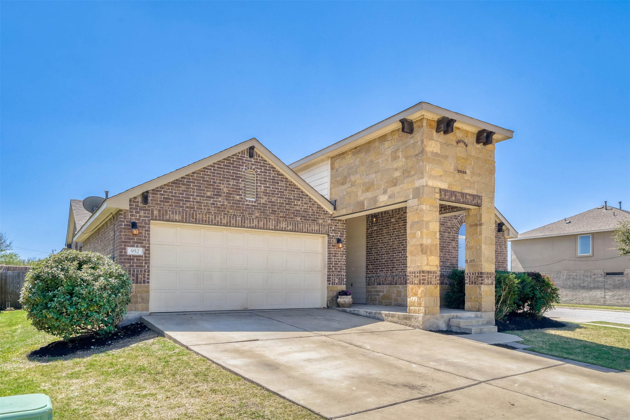 952 Palo Duro Loop Round Rock, TX 78664 - Photo 3 of 37 a view of a house with a small yard and potted plants