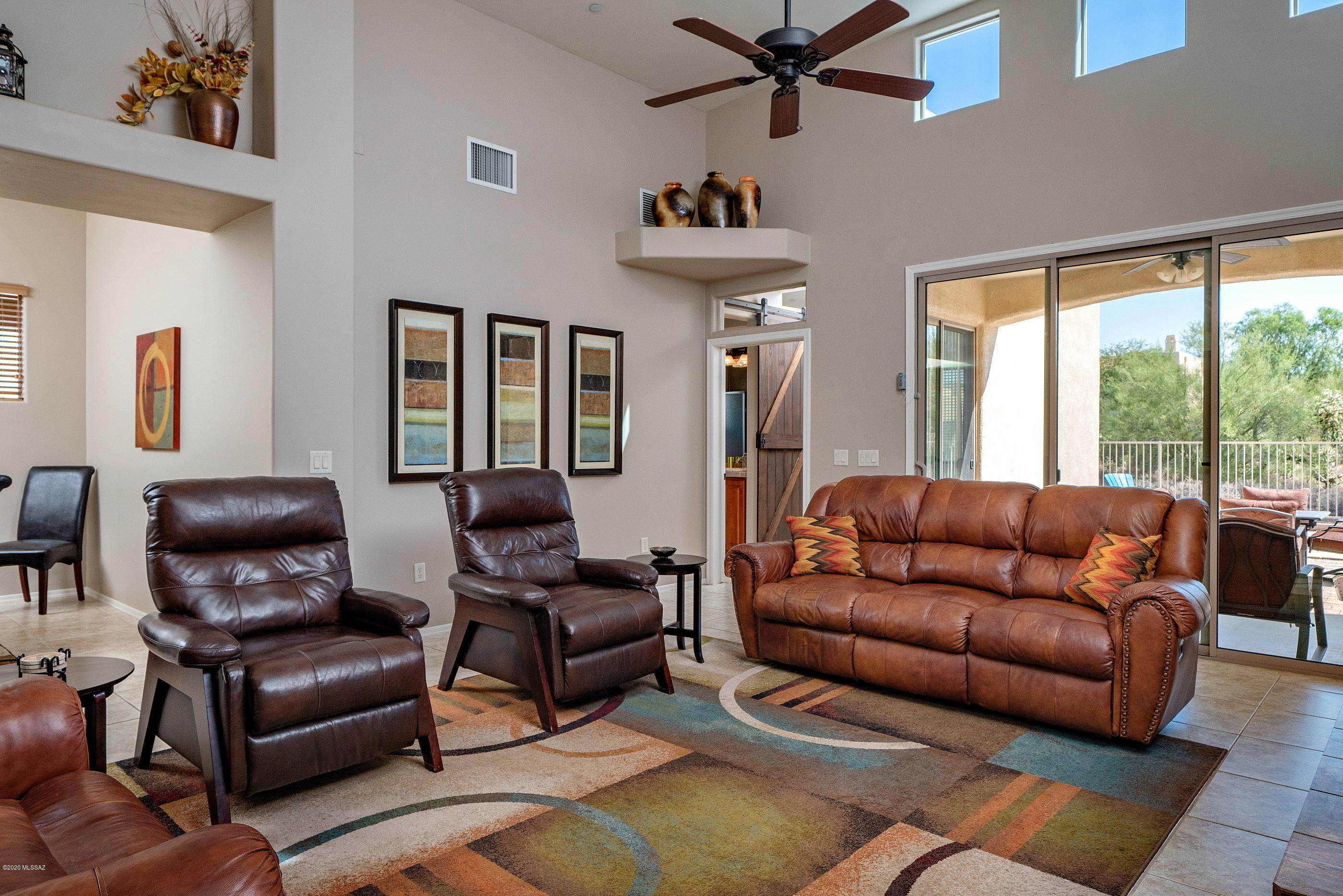 4440 West Crystal Ranch Place Marana, AZ 85658 - Photo 11 of 28 a living room with furniture and a large window