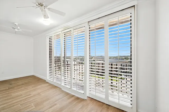 wooden floor and window in an empty room