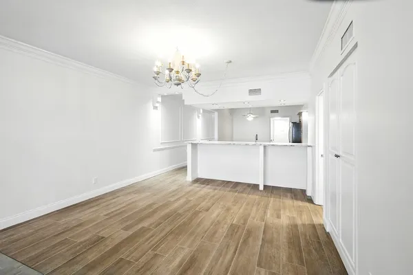 a view of a livingroom with wooden floor