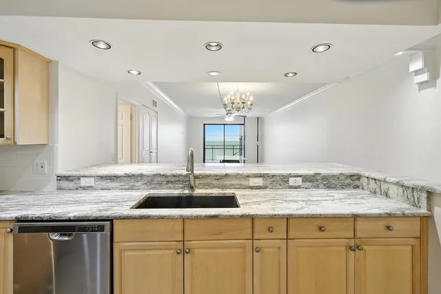 a sink with granite countertop a sink and cabinets