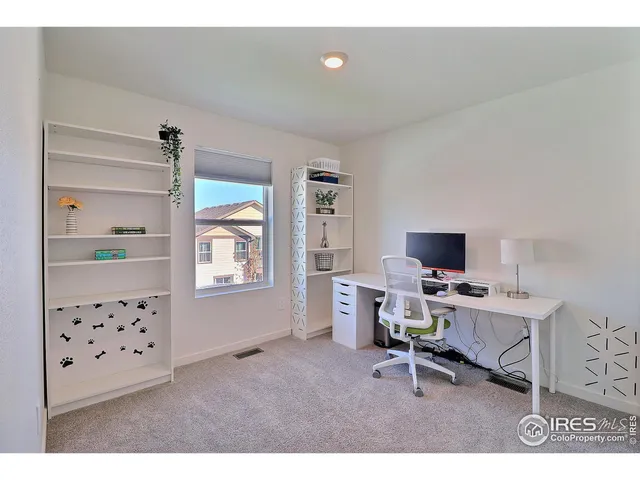 a workspace with furniture and window