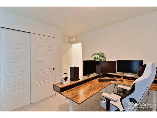 a view of a workspace with furniture