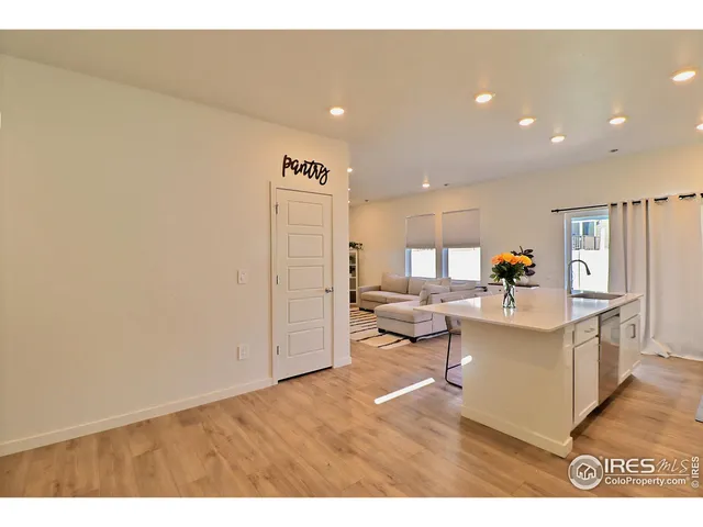 a living room with a table and chairs in it