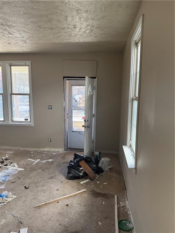 628 Church St Extension Turtle Creek, PA 15145 - Photo 4 of 12 a room with window and couch