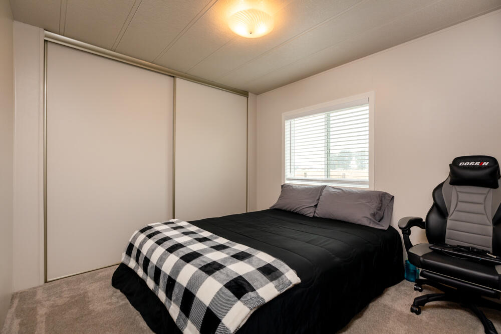 8757 Reeder Road Klamath Falls, OR 97603 - Photo 30 of 34 a bedroom with a bed and a window