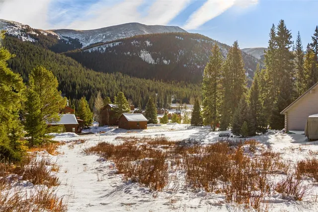 a view of a house with a snow in the yard