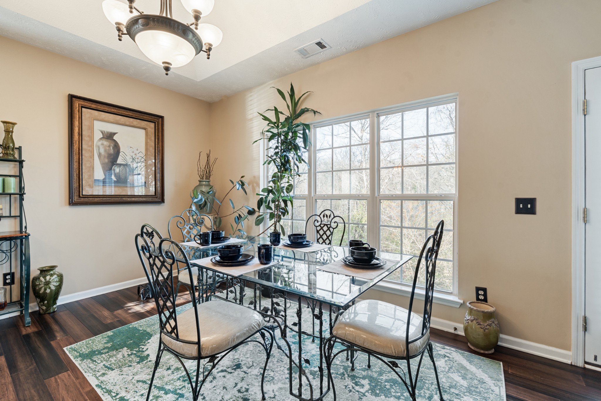 7105 Smokey Hill Road Antioch, TN 37013 - Photo 13 of 30 a dining room with furniture a window and wooden floor