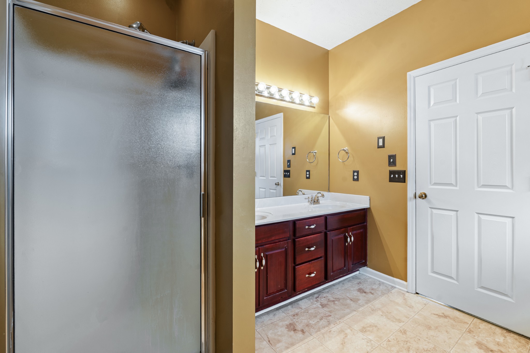 7105 Smokey Hill Road Antioch, TN 37013 - Photo 20 of 30 a bathroom with a granite countertop sink mirror and a