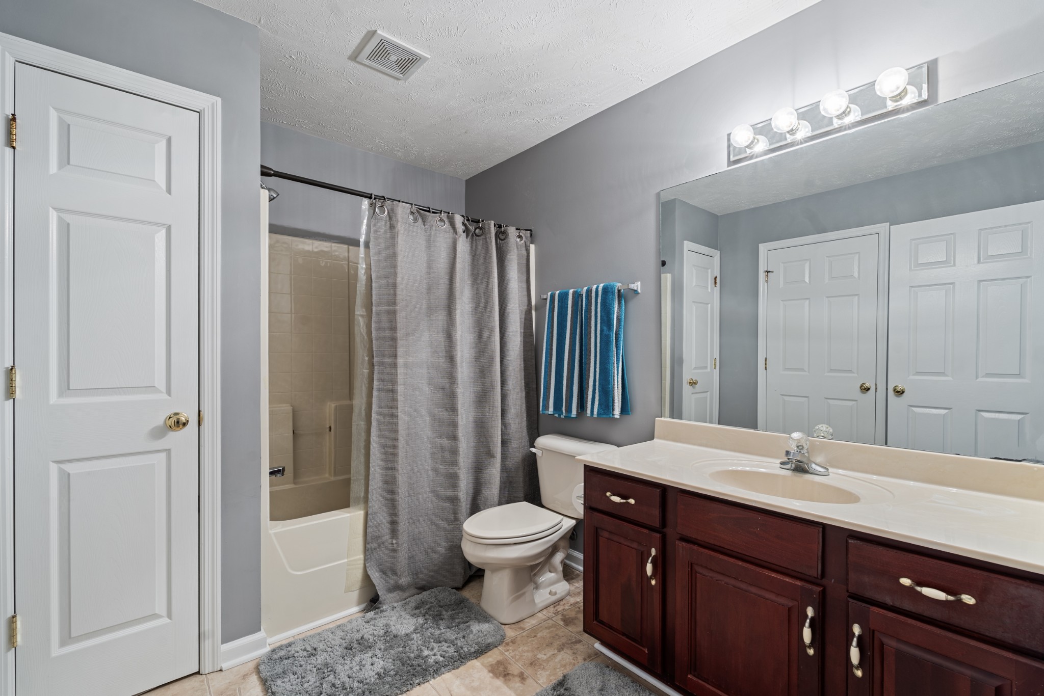 7105 Smokey Hill Road Antioch, TN 37013 - Photo 27 of 30 a bathroom with a toilet a sink and a mirror