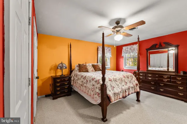 a bedroom with bed and window