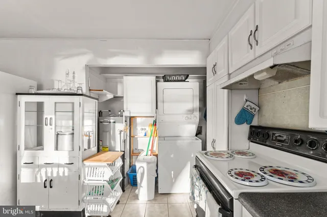 a kitchen with stainless steel appliances granite countertop a refrigerator and a stove