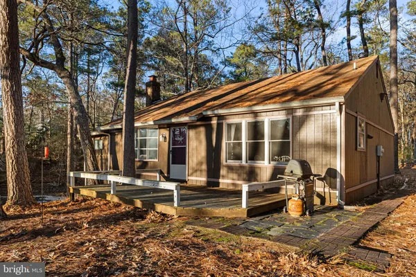 a backyard of a house with barbeque oven