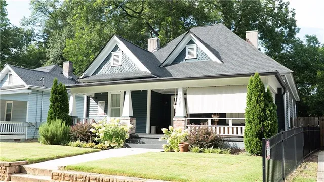 a front view of a house with garden