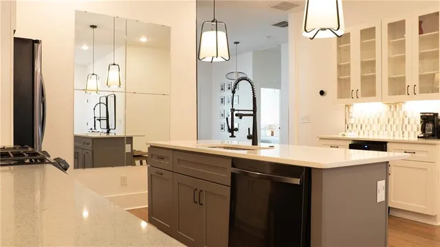 a kitchen with a sink and cabinets