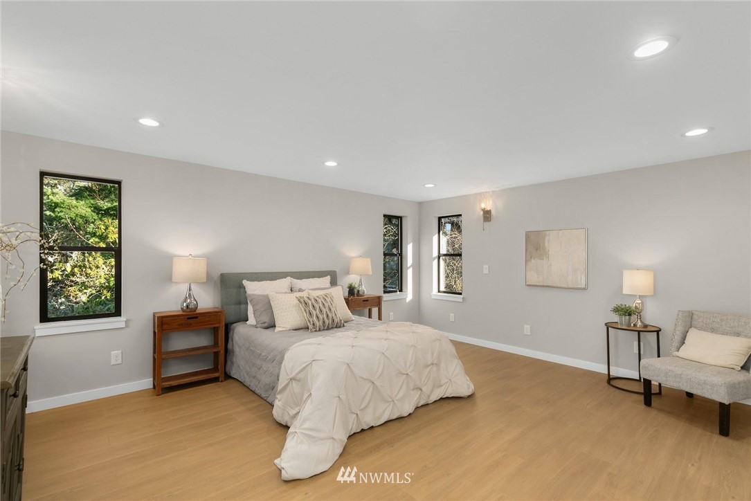 303 217th Place Southwest Bothell, WA 98021 - Photo 15 of 38 a bedroom with a bed and a couch
