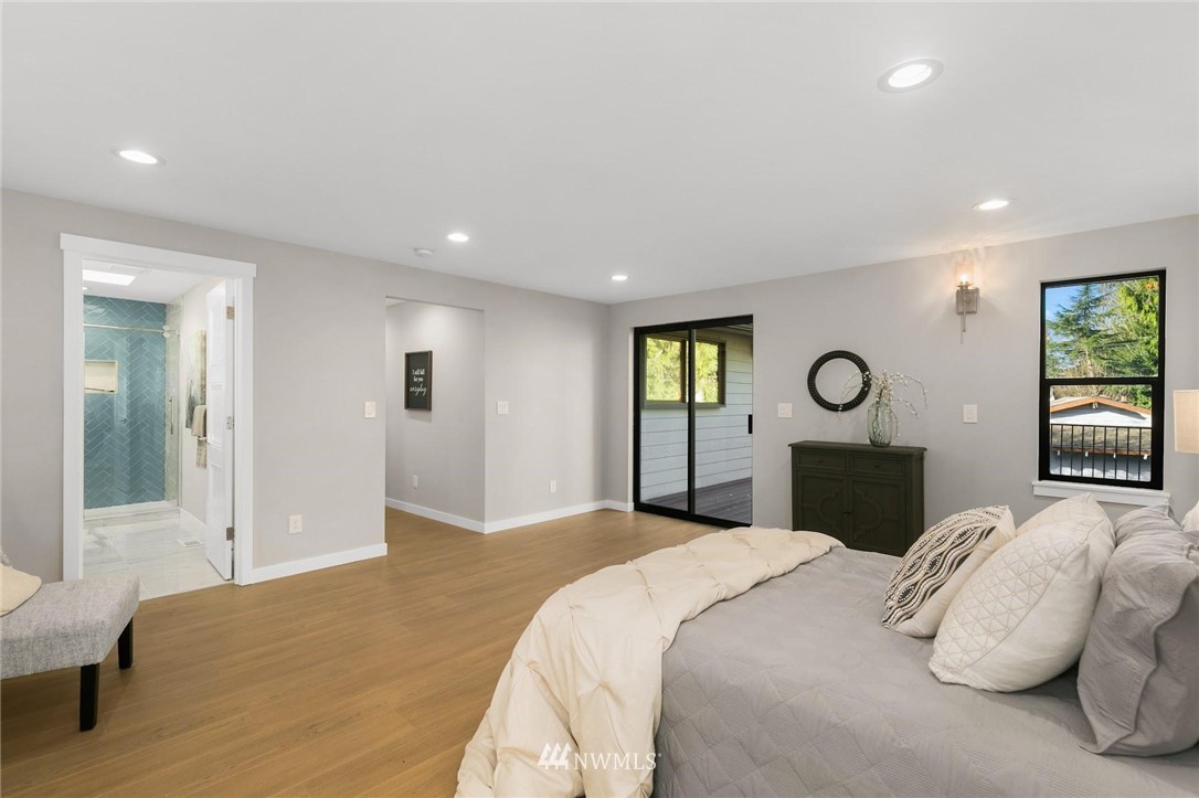 303 217th Place Southwest Bothell, WA 98021 - Photo 17 of 38 a bedroom with a bed and a window