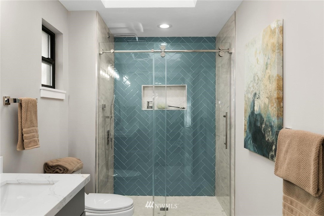 303 217th Place Southwest Bothell, WA 98021 - Photo 19 of 38 a bathroom with a shower and a toilet