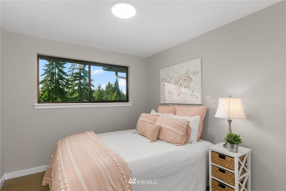 303 217th Place Southwest Bothell, WA 98021 - Photo 21 of 38 a bedroom with a bed and a window