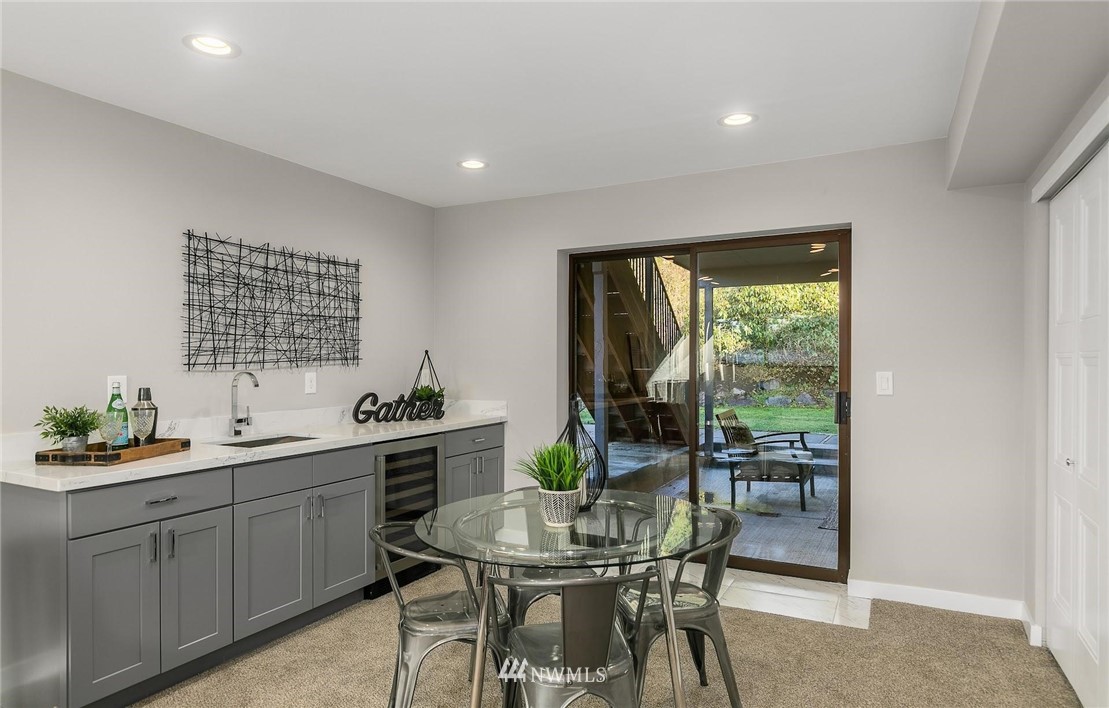 303 217th Place Southwest Bothell, WA 98021 - Photo 26 of 38 a kitchen with a table and chairs in it