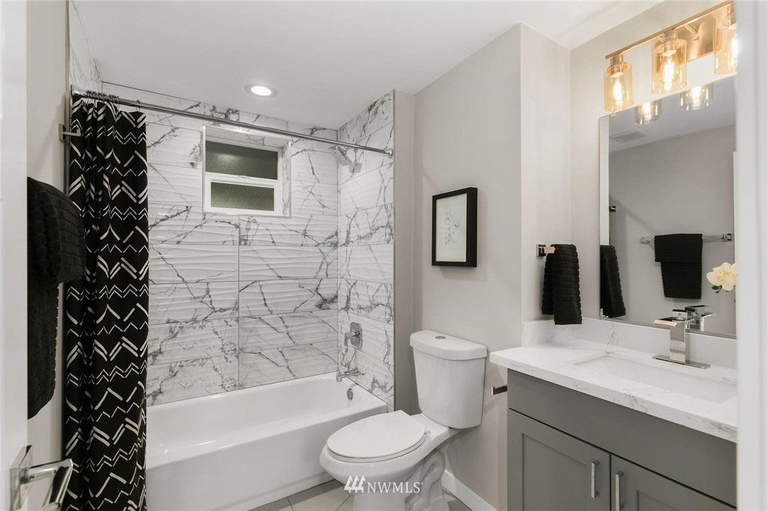 303 217th Place Southwest Bothell, WA 98021 - Photo 28 of 38 a bathroom with a sink toilet and shower