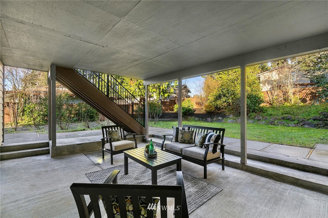 303 217th Place Southwest Bothell, WA 98021 - Photo 30 of 38 a view of chairs and table in patio with a yard