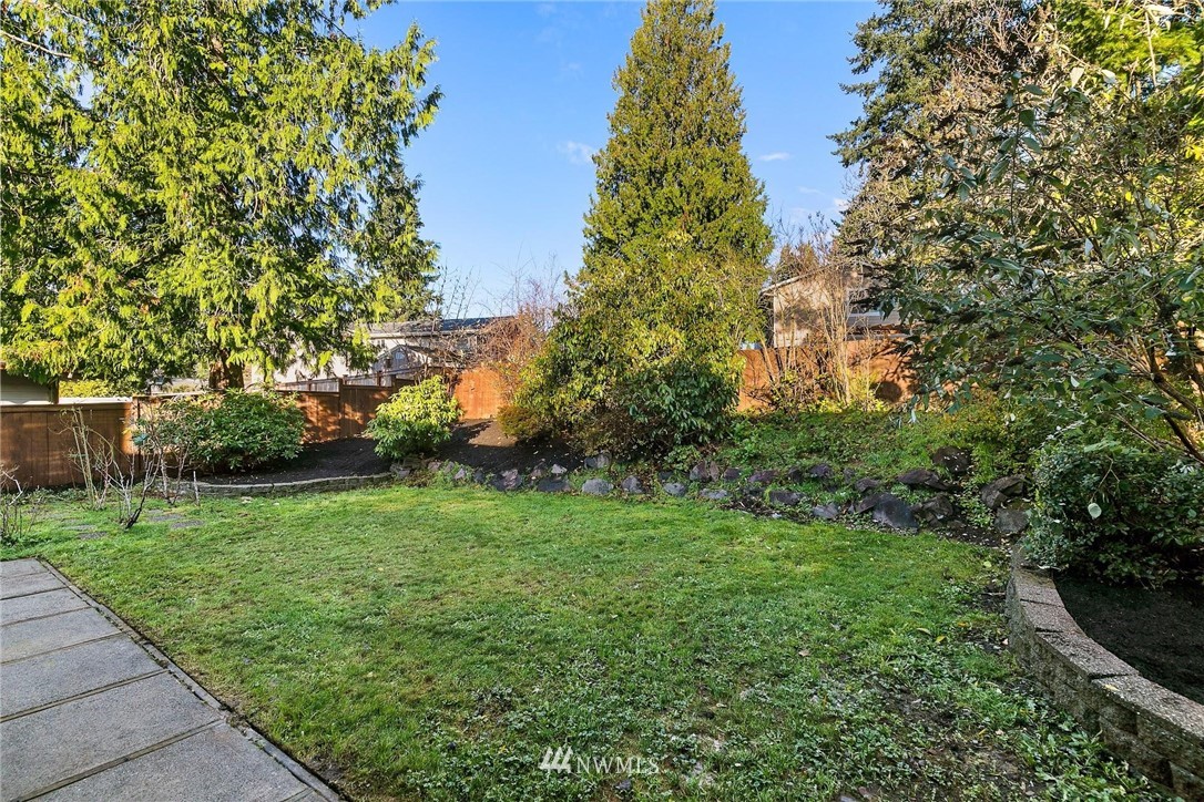 303 217th Place Southwest Bothell, WA 98021 - Photo 31 of 38 a view of a grassy field with trees
