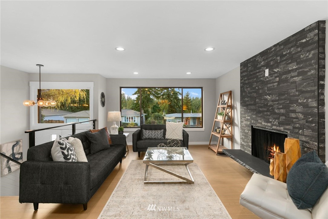 303 217th Place Southwest Bothell, WA 98021 - Photo 5 of 38 a living room with furniture and a fireplace