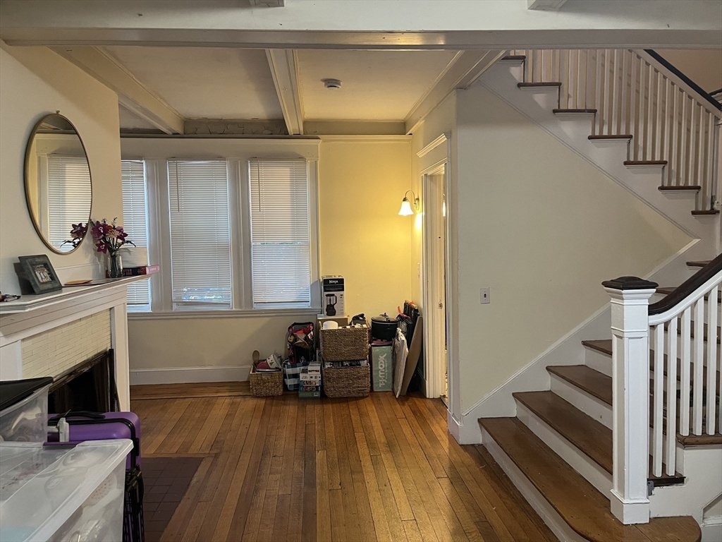 152 Strathmore Road, Unit 2 Boston, MA 02135 - Photo 3 of 5 a view of a livingroom with furniture and a fireplace