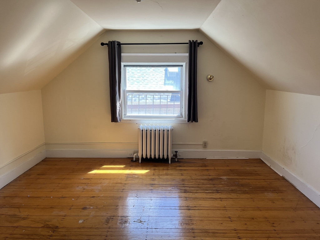 152 Strathmore Road, Unit 2 Boston, MA 02135 - Photo 4 of 5 a view of a room with wooden floor and a window