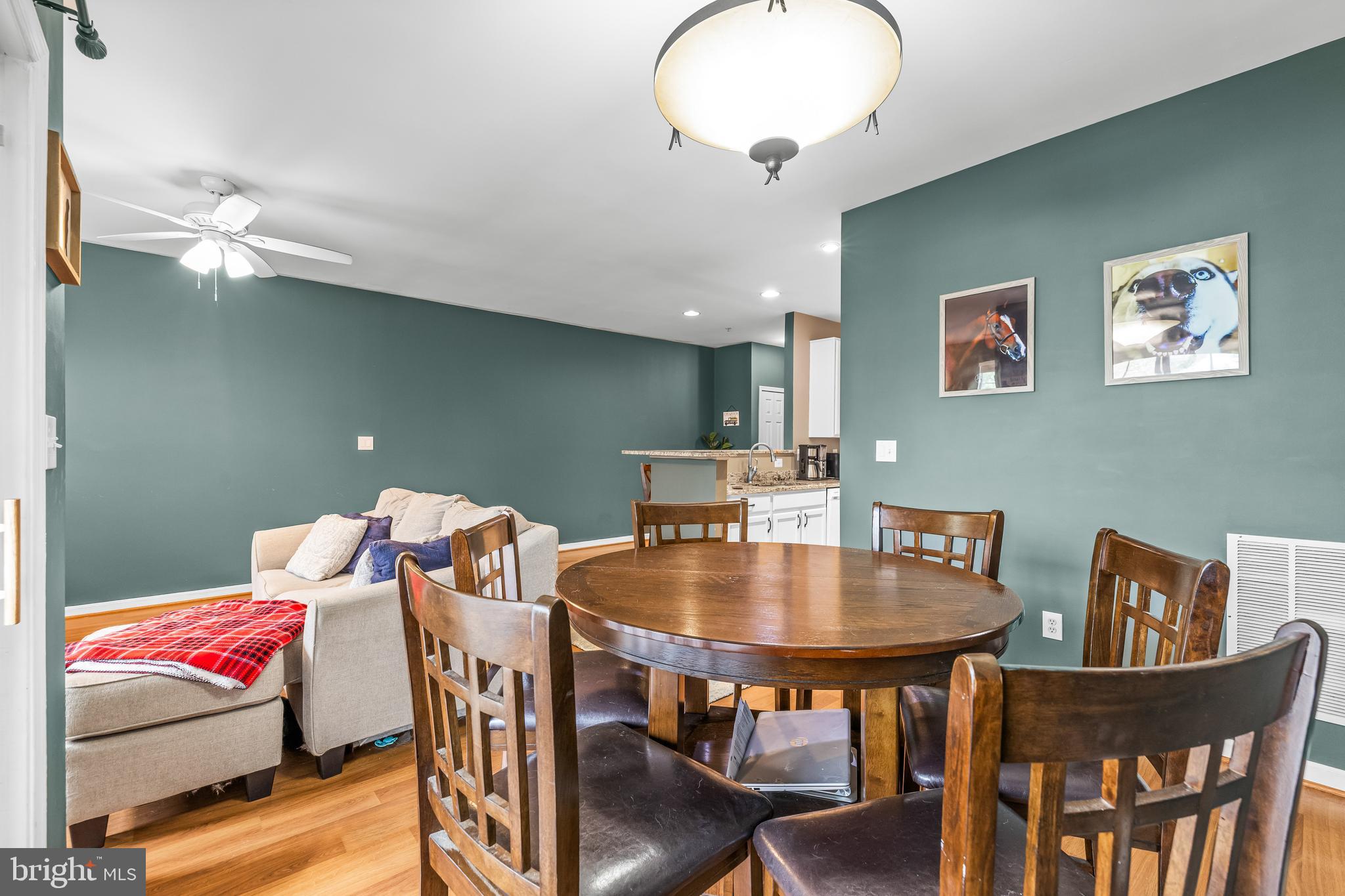 16 Hawk Rise Lane, Unit 204 Owings Mills, MD 21117 - Photo 15 of 33 a view of a dining room with furniture and wooden floor