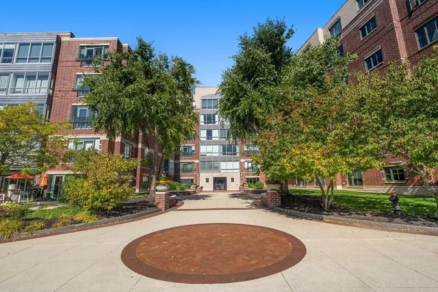 a swimming pool with outdoor seating and yard